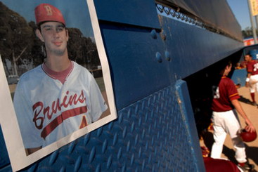 A photo of former Wilson High School player Gary DeVercelly hangs above the Wilson dugout at Blair Field in memory of DeVercelly, 18, who died Friday March 30th after excessive drinking at a fraternity house in Trenton, New Jersey. The Mercer County Prosecutor's office is investigating his death as a possible hazing incident. 